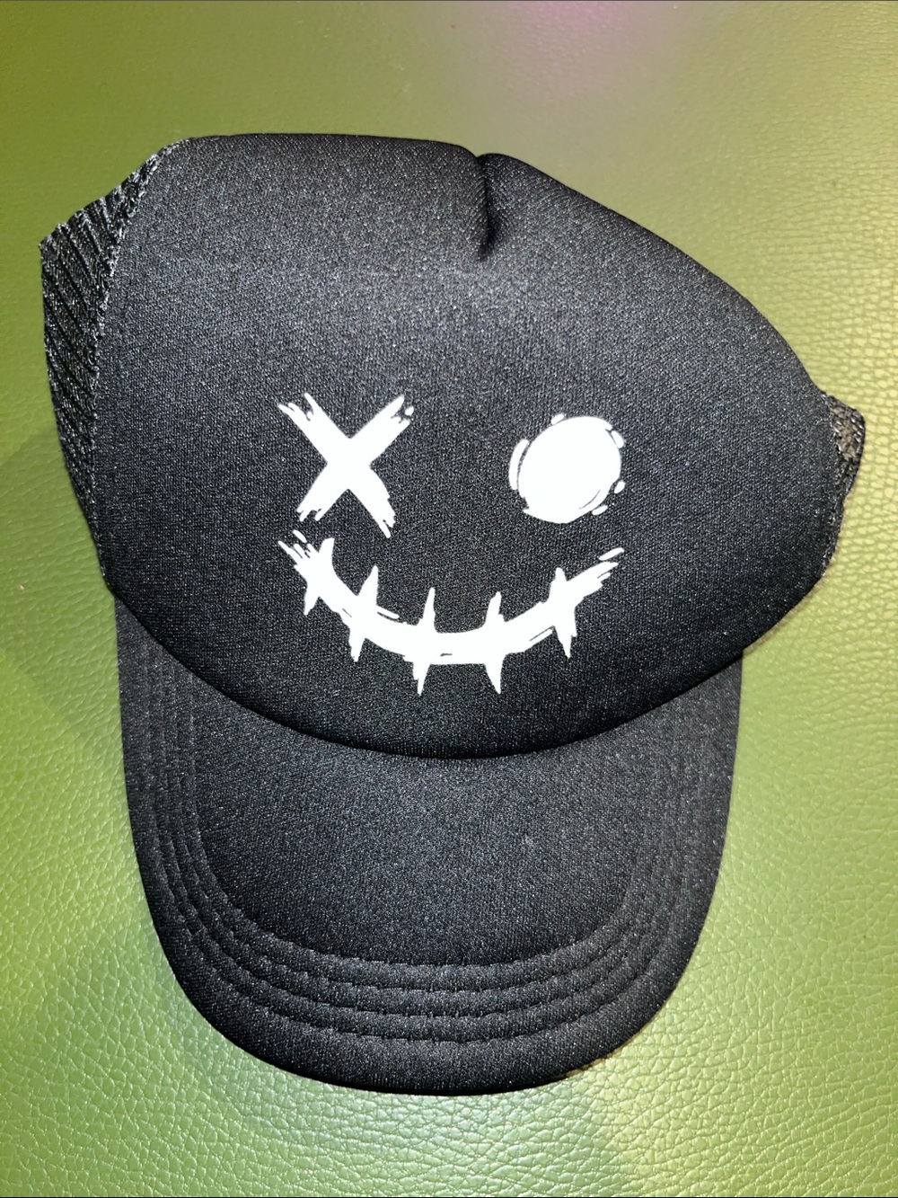 Black Trucker Hat with Smiley Face Graphic